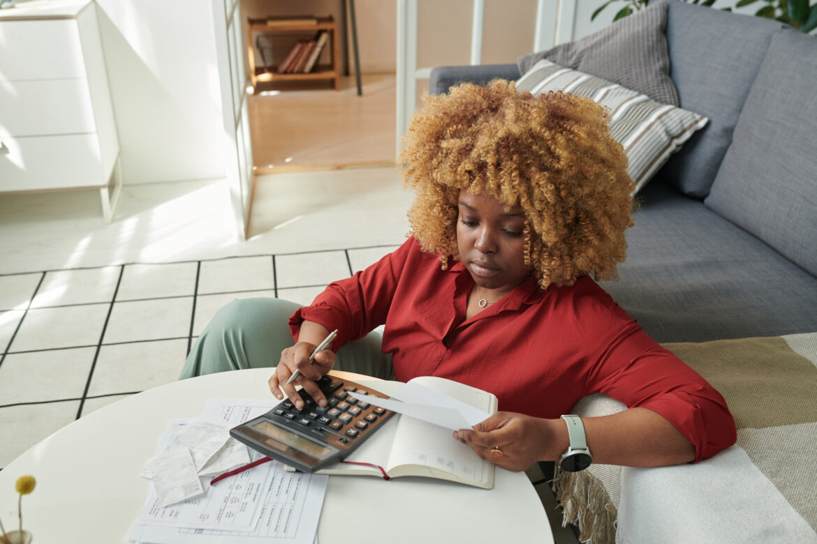Woman managing account finance at home